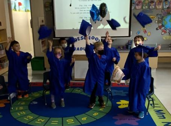 Preschool children toss their hats at circle time!